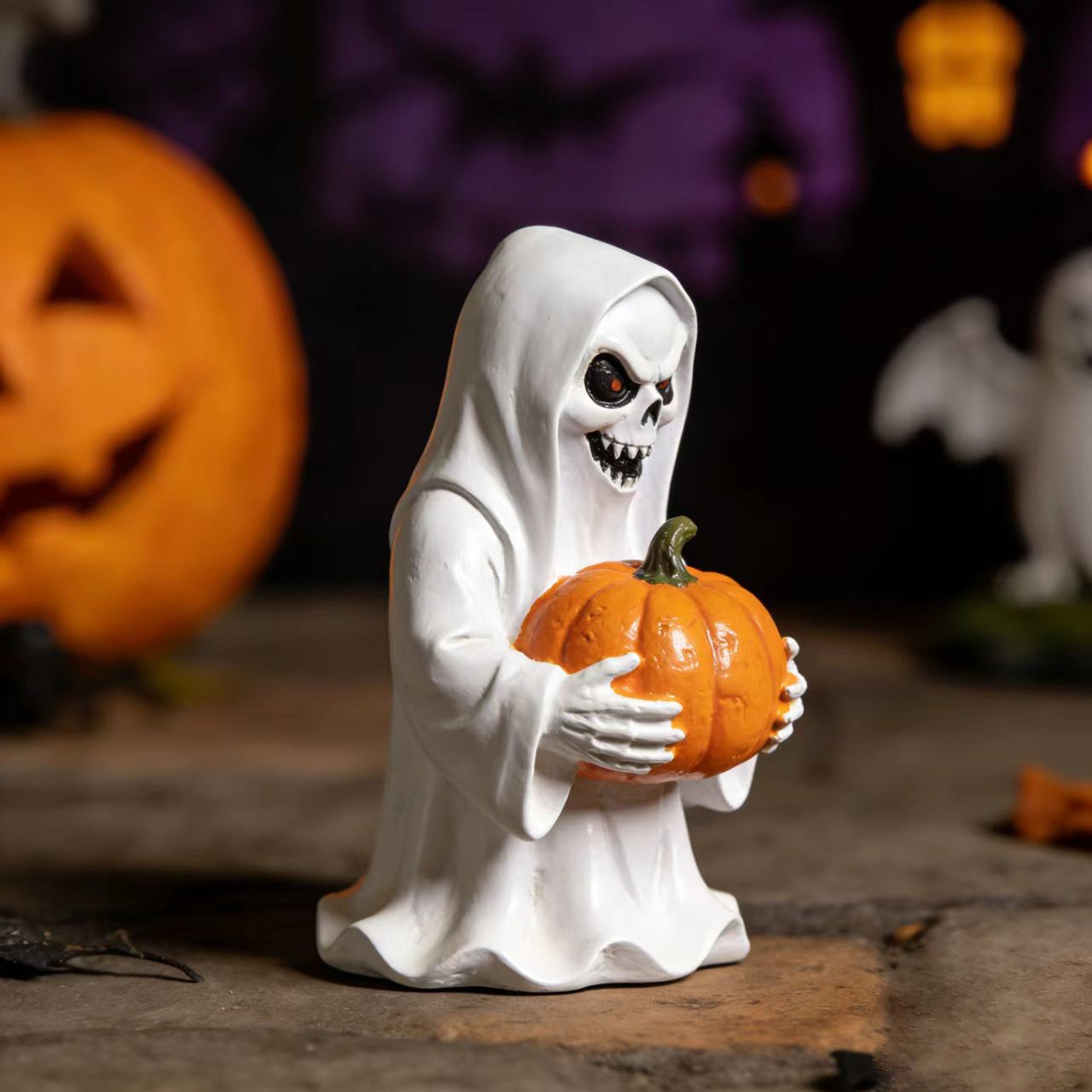 Halloween-style pumpkin skull figurine