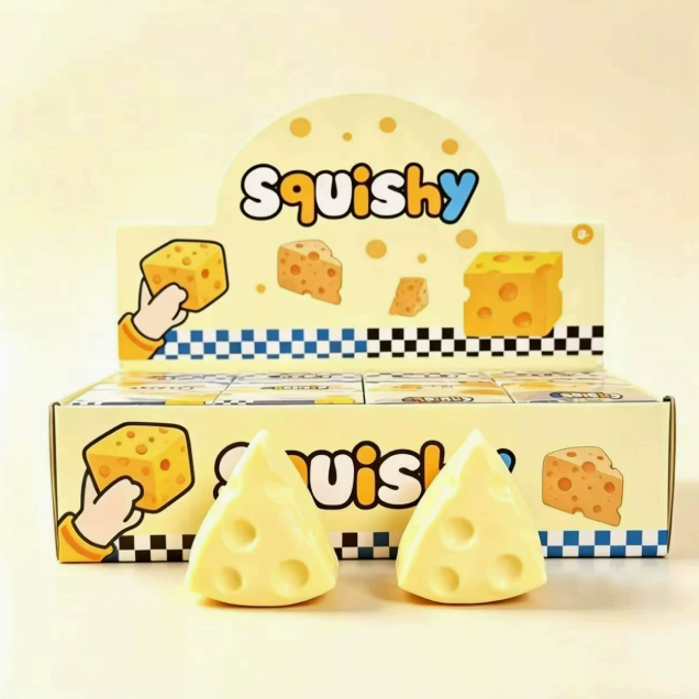 A soft and pliable cheese-shaped squeeze and release toy for relieving stress