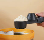 Creative style multi-functional sliding scale measuring spoon