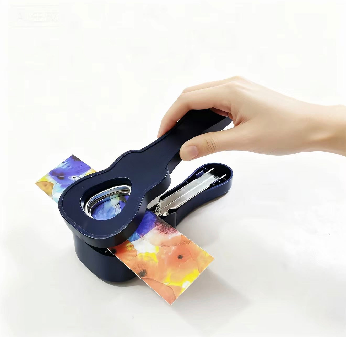 Guitar-shaped hole puncher