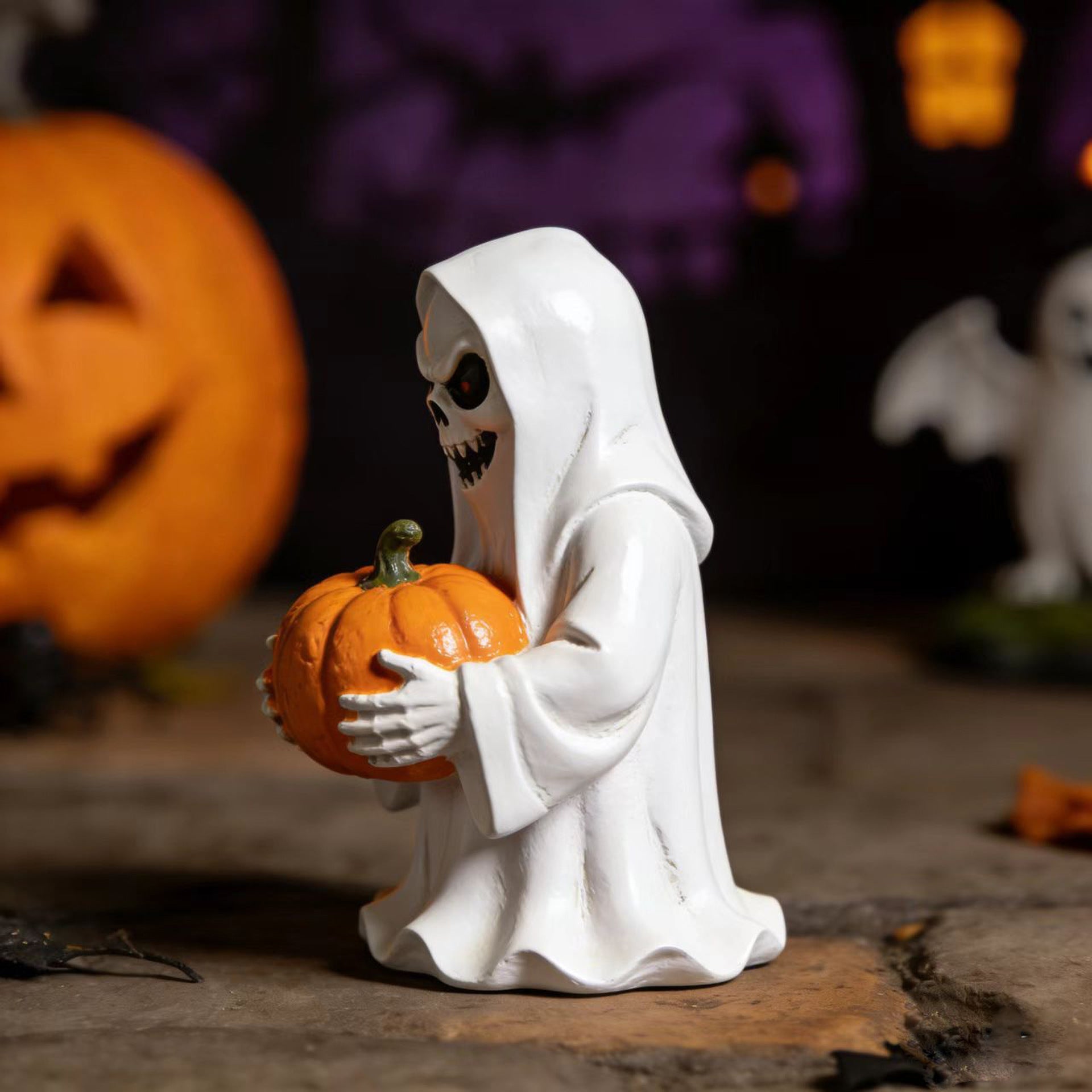 Halloween-style pumpkin skull figurine
