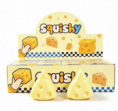 A soft and pliable cheese-shaped squeeze and release toy for relieving stress