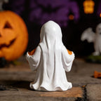 Halloween-style pumpkin skull figurine